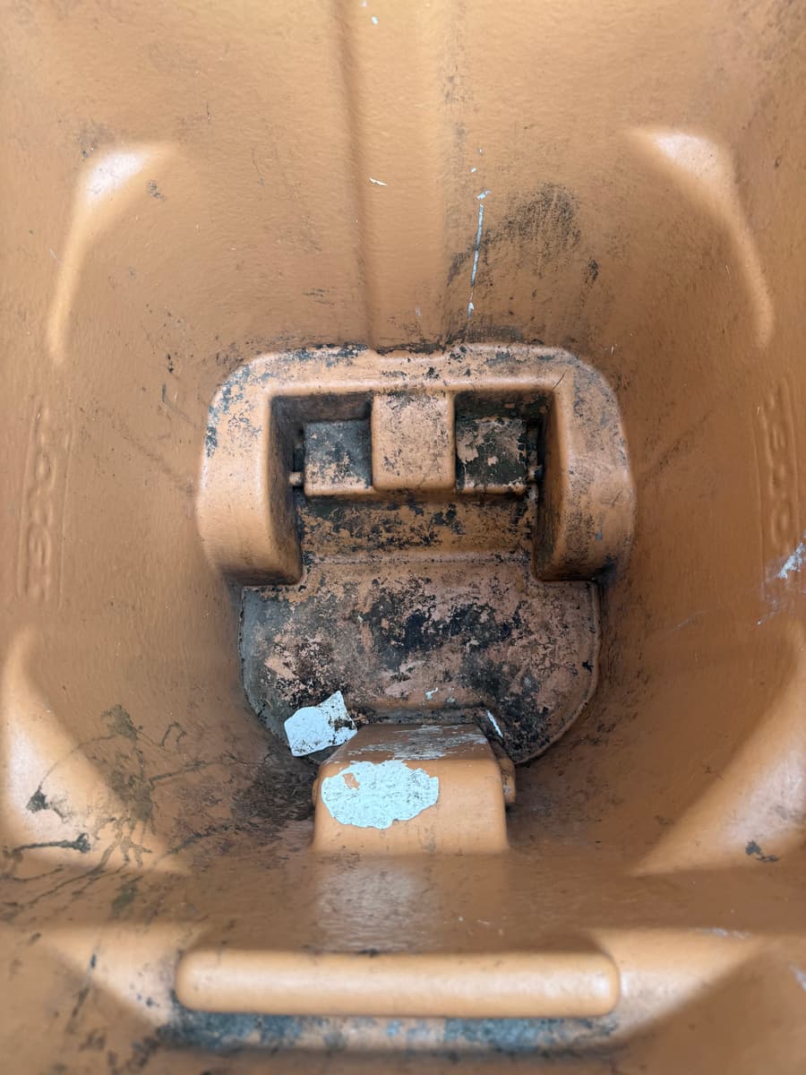 Dirty trash can interior before professional cleaning